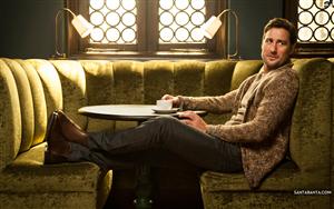 Luke Wilson, an American actor, relaxing with a cup of tea